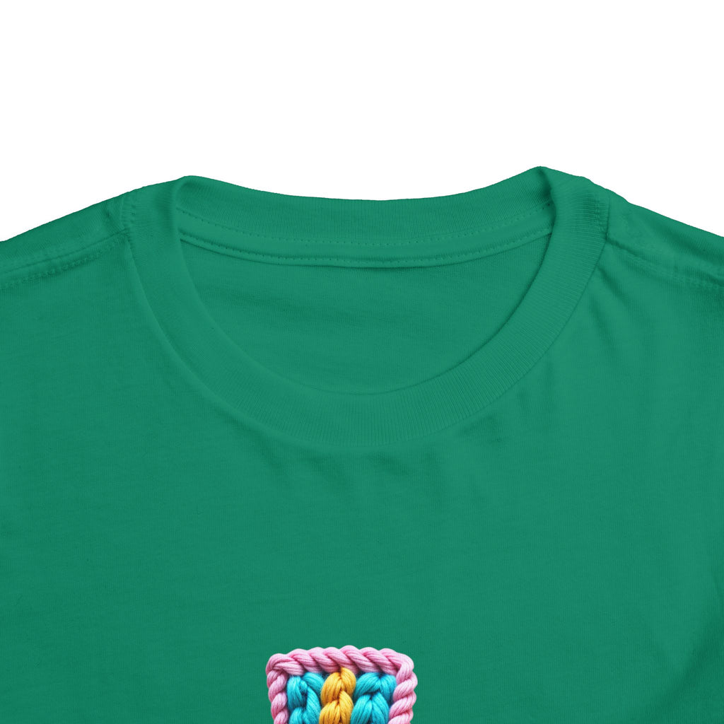 Easter Cross Toddler Tee — Colorful Knit Cross with "He is Risen" & Easter Eggs