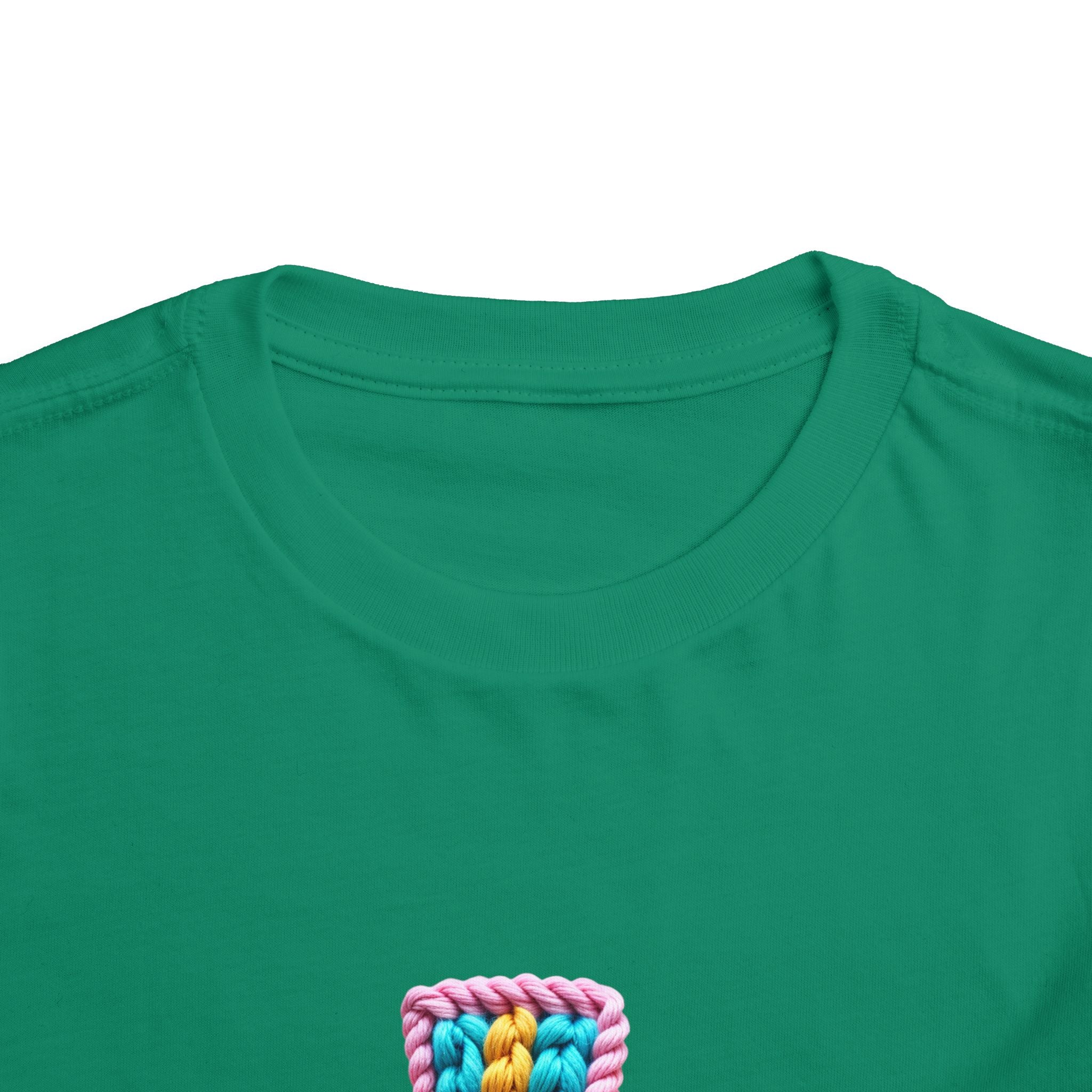 Easter Cross Toddler Tee — Colorful Knit Cross with "He is Risen" & Easter Eggs