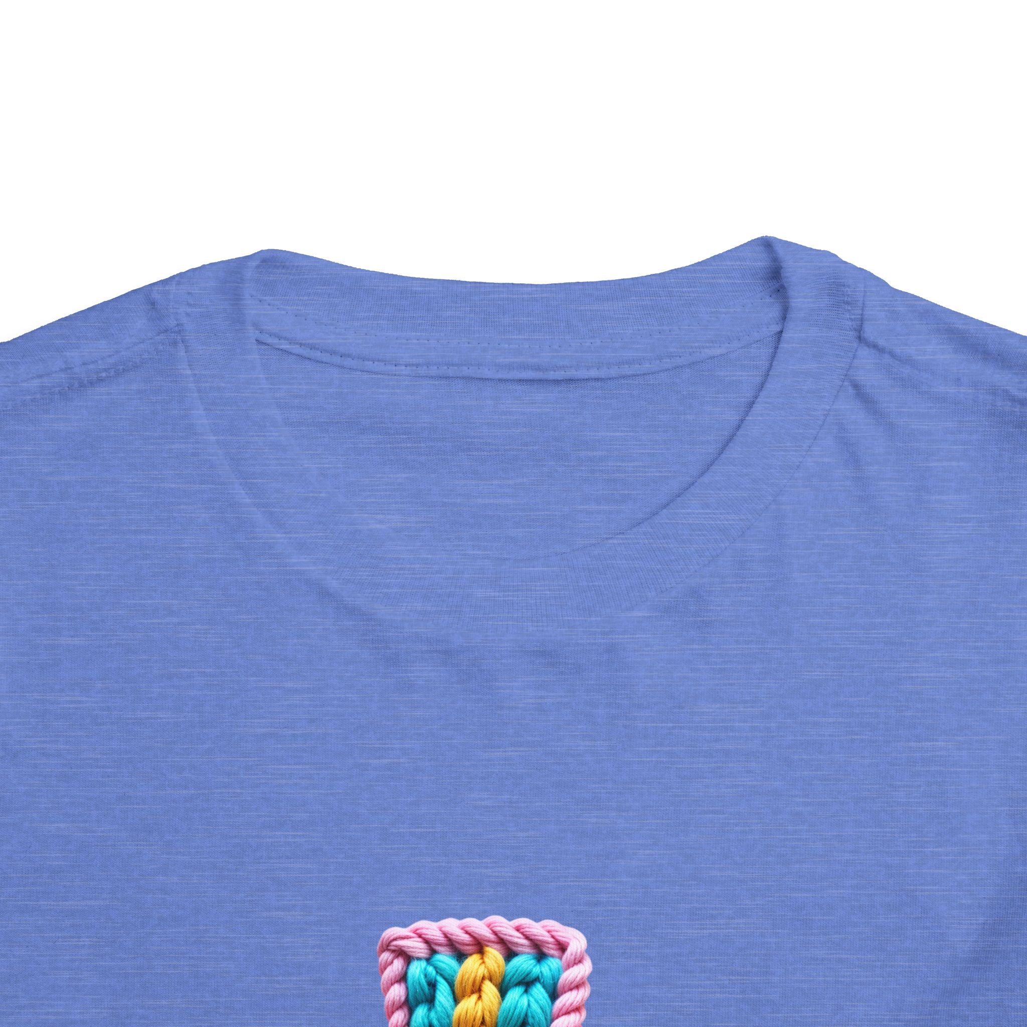 Easter Cross Toddler Tee — Colorful Knit Cross with "He is Risen" & Easter Eggs