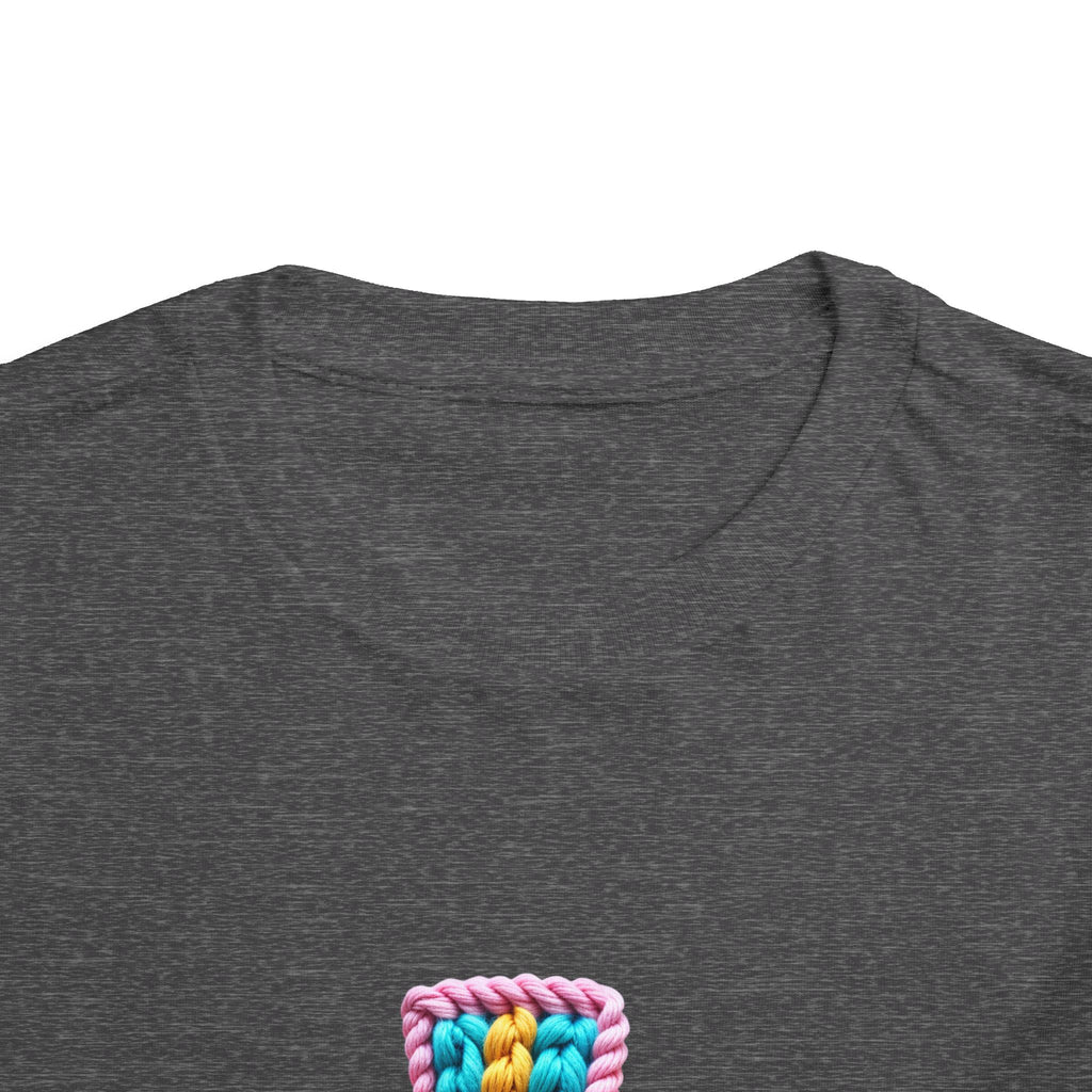 Easter Cross Toddler Tee — Colorful Knit Cross with "He is Risen" & Easter Eggs