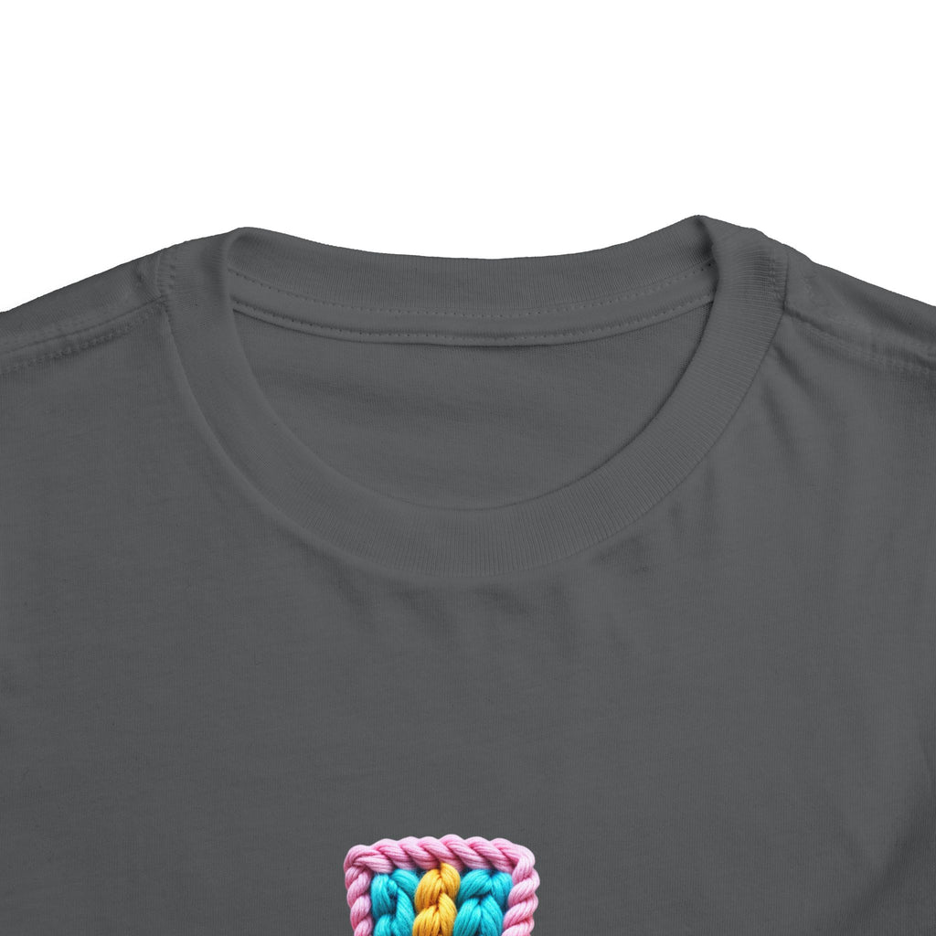 Easter Cross Toddler Tee — Colorful Knit Cross with "He is Risen" & Easter Eggs