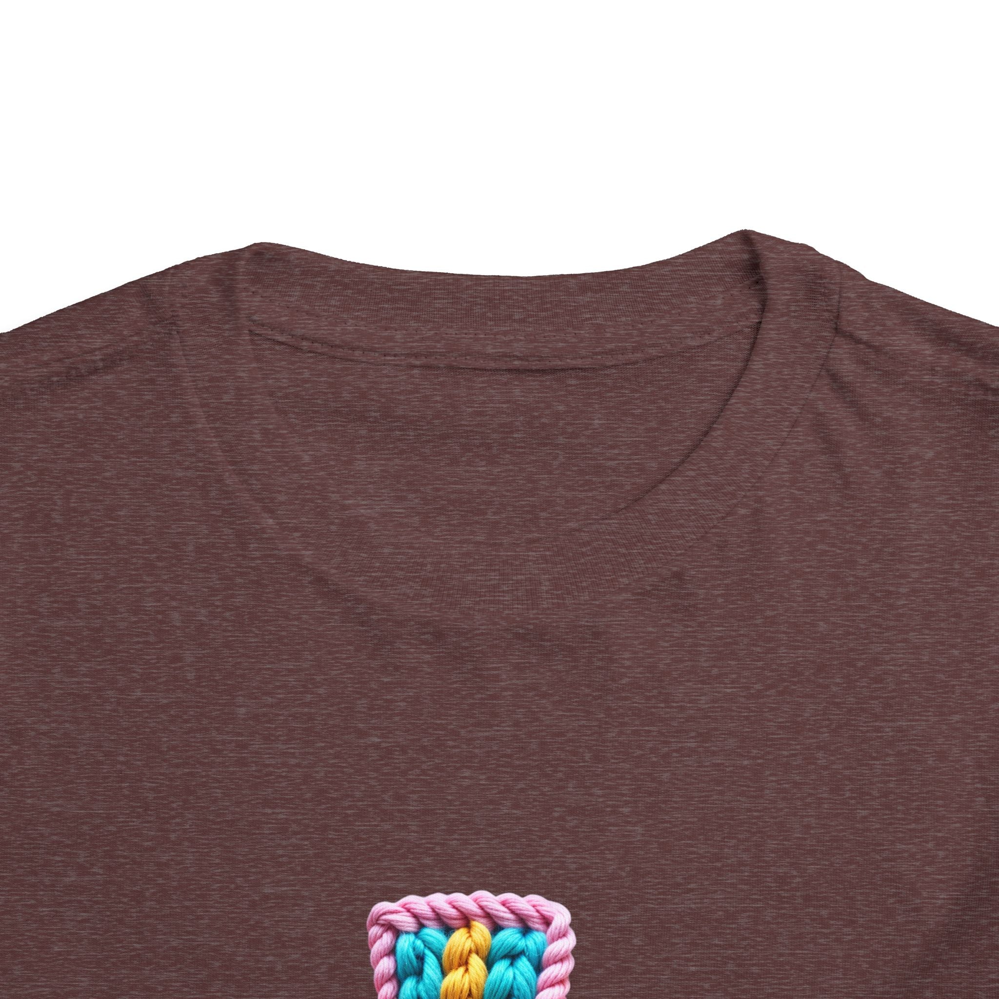 Easter Cross Toddler Tee — Colorful Knit Cross with "He is Risen" & Easter Eggs