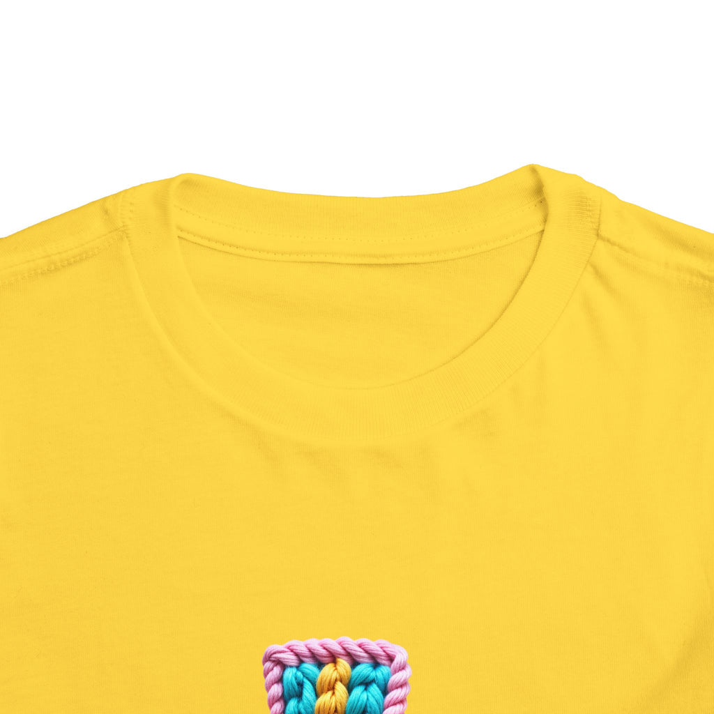 Easter Cross Toddler Tee — Colorful Knit Cross with "He is Risen" & Easter Eggs
