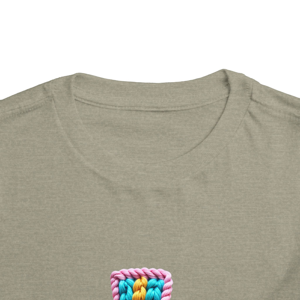 Easter Cross Toddler Tee — Colorful Knit Cross with "He is Risen" & Easter Eggs