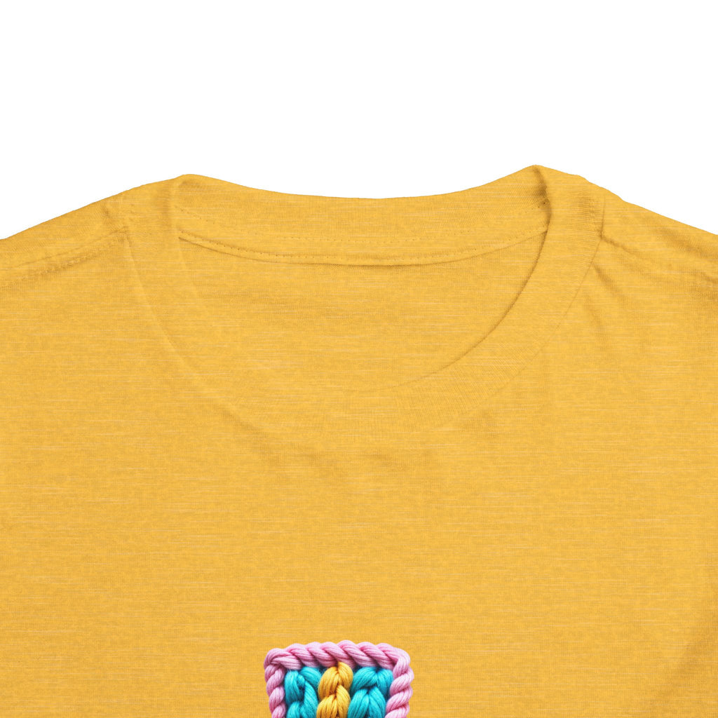 Easter Cross Toddler Tee — Colorful Knit Cross with "He is Risen" & Easter Eggs